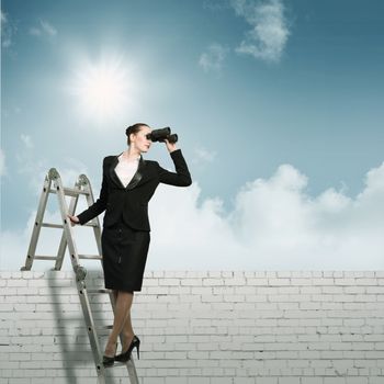 businesswoman climbed a ladder and looking through binoculars