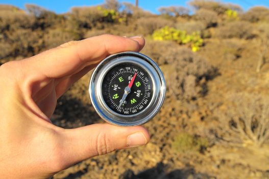 Orientation Concept a Male Hand Holding a Metal Compass