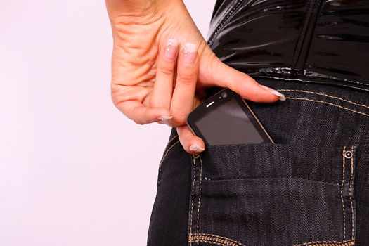 close up of cell phone in back pocket