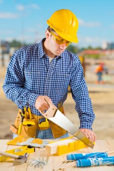 men cutting with hansaw