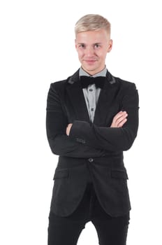 Man in jacket and bow-tie standing with crossed arms