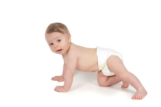 Side view of little crawling baby in white background