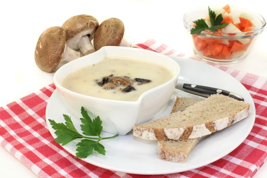 a bowl of veal cream soup with mushrooms