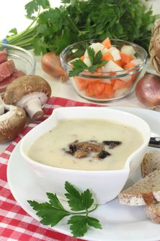 a bowl of veal cream soup with mushrooms