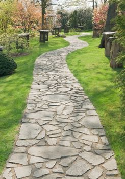 Stone walkway in the park on a sunny spring day