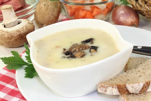 a bowl of veal cream soup with mushrooms