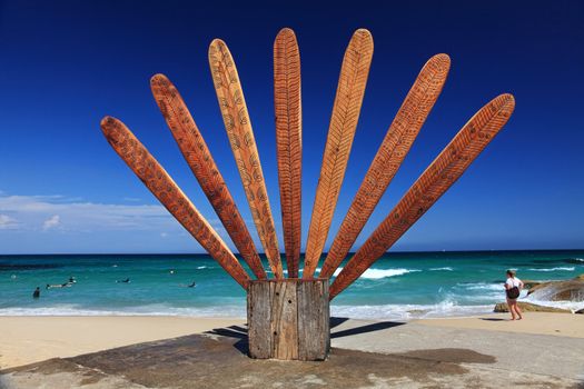 Bondi to Tamarama, Australia - November 9,  2013: Sculpture By The Sea, 2013. Annual cultural event that showcases emerging artists from around the world  Sculpture titled 'A tale of romance' by Kathy Howlowko (VIC).  Medium reclaimed timber.  Price $6500