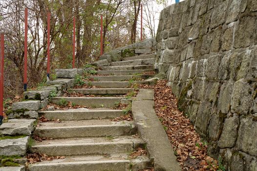 Stairs mada of stones at stone wall