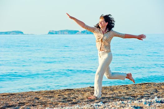 she actively moving on the shore near the sea