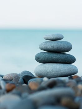 Stack of round smooth stones on a seashore