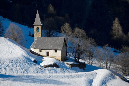 Small church in a snowy landscape