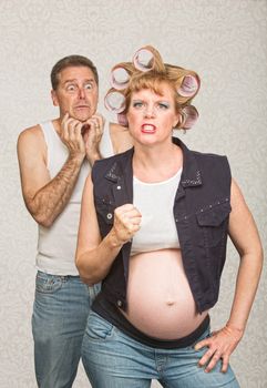 Intimidating pregnant hillbilly woman with scared husband
