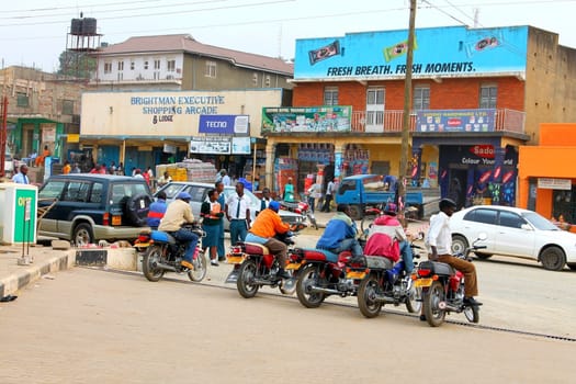 Fort portal, Uganda - 6 March: Ugandan taxi drivers are standing in the street and waiting for clients of 6 March 2012 in the city of Fort portal, Uganda.