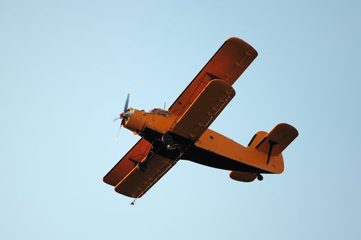 Old airplane against blue sky