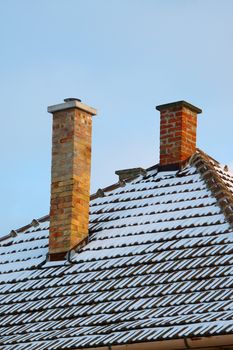 Chimney on a roof oh a house