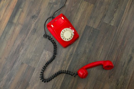 Red vintage phone on the floor