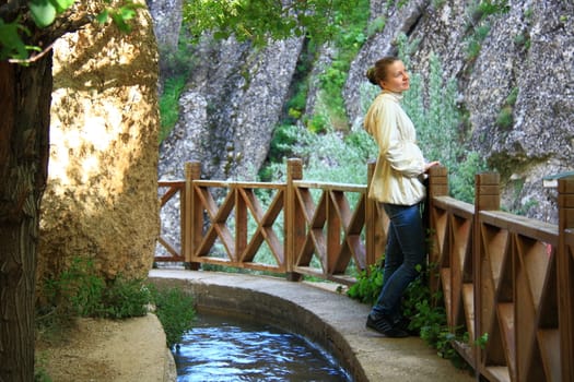 woman smiling on water balcony and looking sky