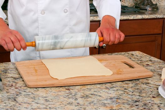 Rolling dough making beef wellington