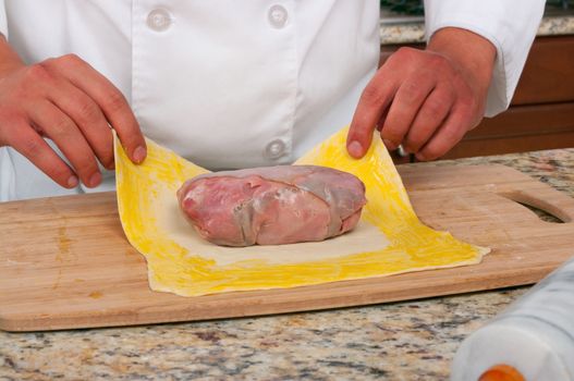 Chef making beef wellington