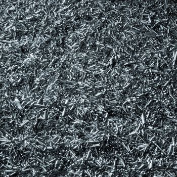 abstract background with lots of metallic swarf, blue toned