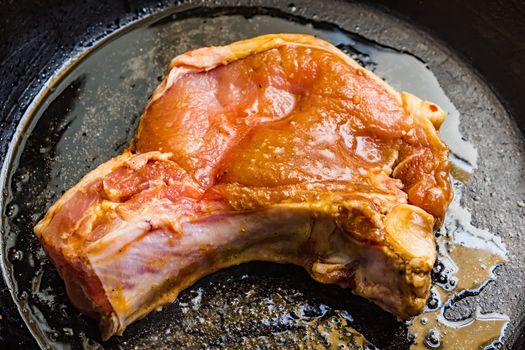 Roasted pork steak in a frying pan