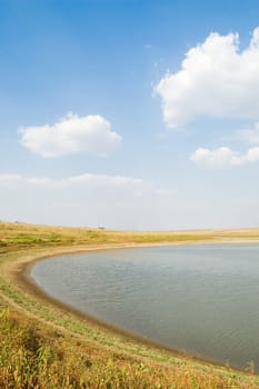 lagoon of small lake with cloud on the sky