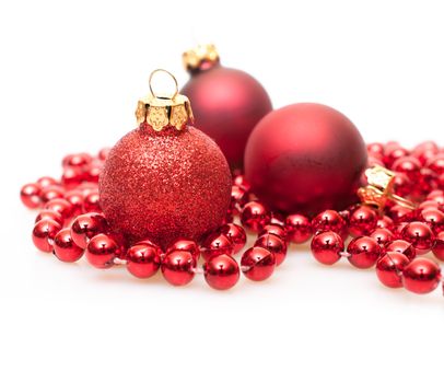 Christmas Background - Red Christmas Baubles on White Background - Shallow Depth of Field