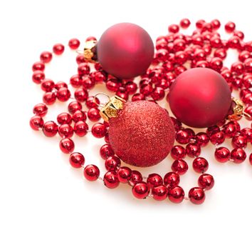 Christmas Background - Red Christmas Baubles on White Background - Shallow Depth of Field