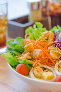 close up shrimp and  fresh vegetable salad with  sauce in  bowl , healthy food
