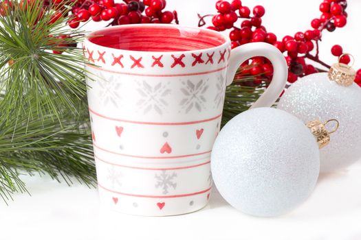 cup of tea with xmas decoration isolated on white background