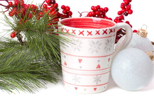 cup of tea with xmas decoration isolated on white background