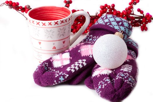 Cozy red gloves hold a mug of hot cocoa