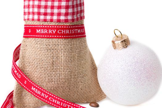 closed sack bag with red bow isolated on white background