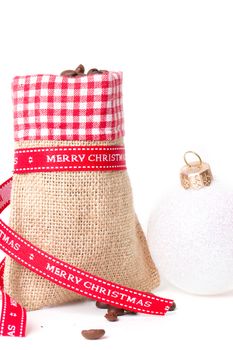 closed sack bag with red bow isolated on white background