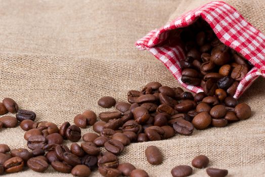 Coffee beans in sack,  burlap background