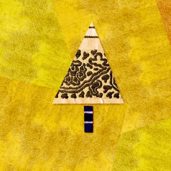 vibrant colorful background in yellow Christmas tree made with fabric and paper scraps