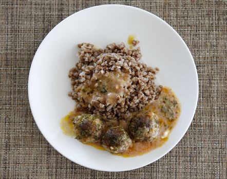 Buckwheat with small meat balls and red souse