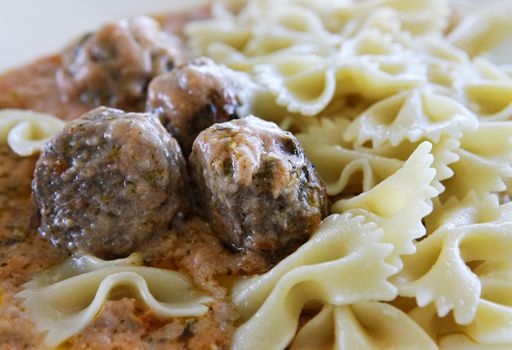 Small buckwheat cakes with pasta and sauce