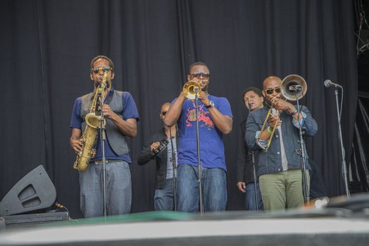 Each year the first week in August held a blues festival in Notodden, Norway. Photo is shot from the concert with Tedeschi Trucks Band. The band members are: Susan Tedeschi ��� lead vocals, rhythm guitar. Derek Trucks ��� lead guitar. Kofi Burbridge ��� keyboards, flute. Tyler Greenwell ��� drums, percussion. J. J. Johnson ��� drums, percussion. Kebbi Williams ��� saxophone. Maurice Brown ��� trumpet. Saunders Sermons ��� trombone. Mike Mattison ��� harmony vocals. Mark Rivers ��� harmony vocals.