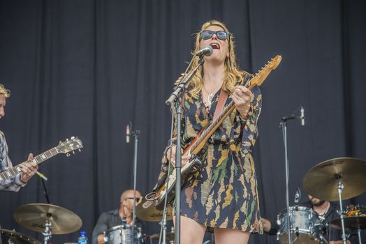 Each year the first week in August held a blues festival in Notodden, Norway. Photo is shot from the concert with Tedeschi Trucks Band. The band members are: Susan Tedeschi ��� lead vocals, rhythm guitar. Derek Trucks ��� lead guitar. Kofi Burbridge ��� keyboards, flute. Tyler Greenwell ��� drums, percussion. J. J. Johnson ��� drums, percussion. Kebbi Williams ��� saxophone. Maurice Brown ��� trumpet. Saunders Sermons ��� trombone. Mike Mattison ��� harmony vocals. Mark Rivers ��� harmony vocals. 
