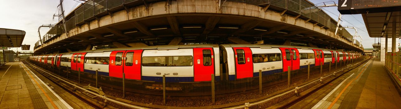 London underground. Long subway train ready to leave the station.