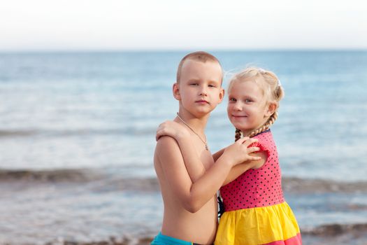 portrait of two children on the beach