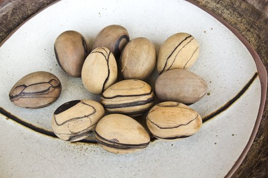 Wooden in oval shape used for massage and decorated