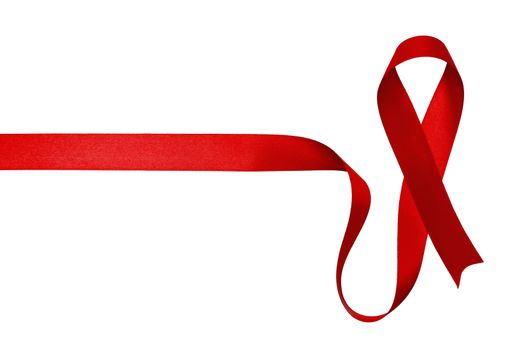 Shiny red satin ribbon on white background