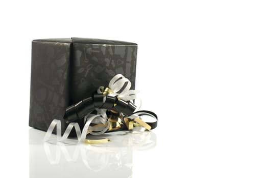 black present box with gold and silver bow