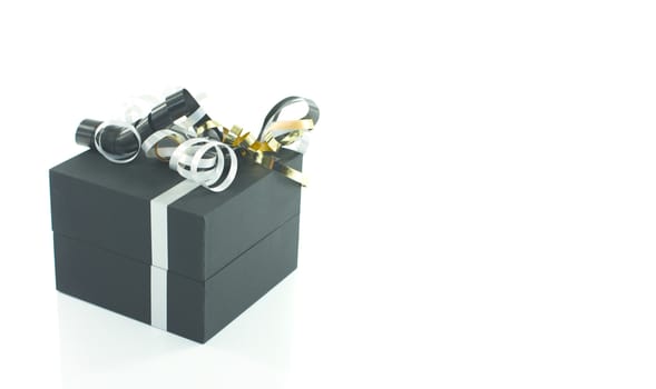 black present box with gold and silver bow