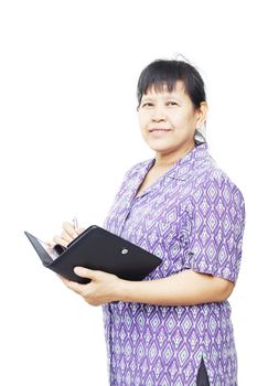 senior smiling woman holding pen and notebook