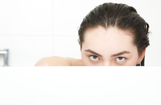 Wet lady in the white bath