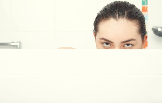 Wet lady in the white bath