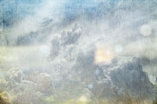 Cloudy sky with textured overlay.